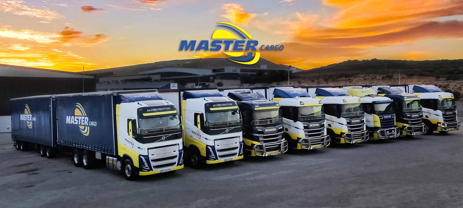 Master Cargo fleet lined up at sunset