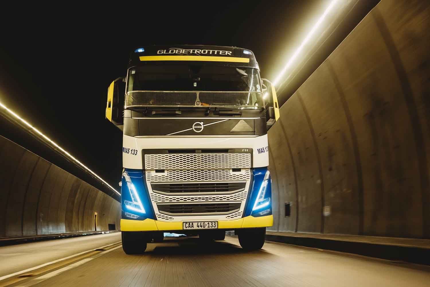 Master Cargo truck driving through a tunnel at night